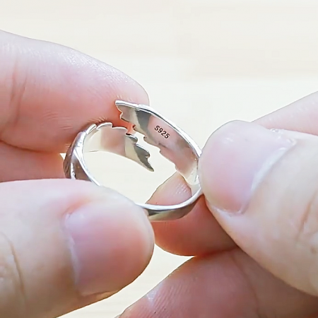 The S925 quality stamp engraved inside a sterling silver ring from the set.