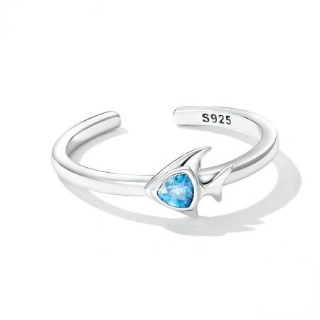 Close-up view of the S925 stamp on a sterling silver ring with a light blue teardrop gemstone.