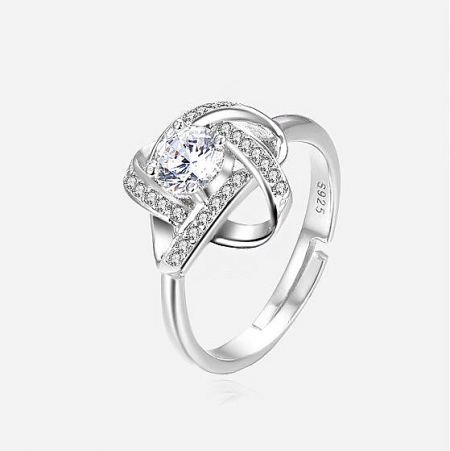 The S925 stamp visible on the inner band of the hollow clover design sterling silver ring.