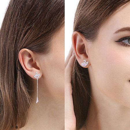 Product shot showcasing two variations of the swan-shaped earrings.