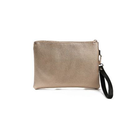 Side view of the tan clutch purse highlighting the black wrist strap and sleek profile.