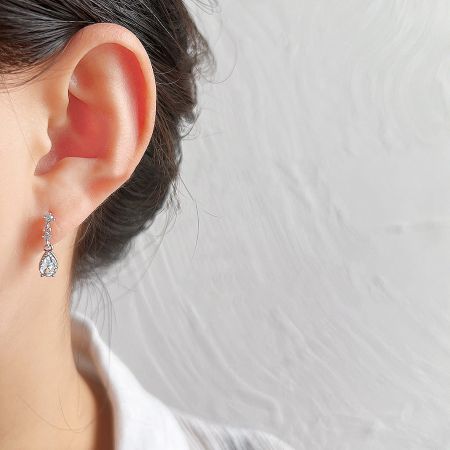 Model wearing the elegant waterdrop drop earrings.