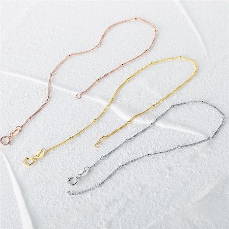 Product shot of the 925 sterling silver bead bracelets in all three available colors: silver, gold, and rose gold.