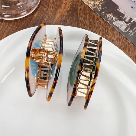 Back view of the Evil Eye hair clips, displaying the strong and durable gold-tone metal clasp.