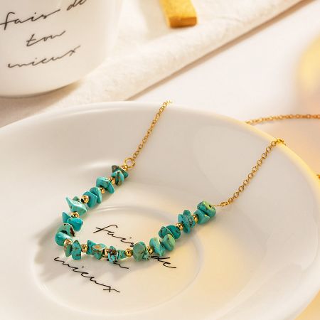 The complete stainless steel turquoise necklace laid out to display its full length and design details.