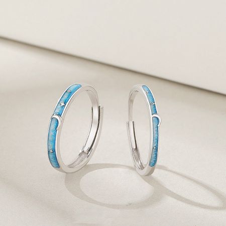 925 Sterling Silver Star Moon Enamel Adjustable Couple Ring Set - A pair of 925 sterling silver adjustable couple rings with a celestial star and moon design highlighted by blue enamel.