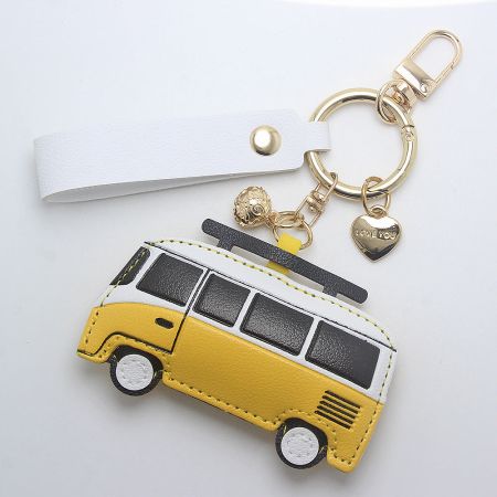 A charming yellow retro van PU leather keychain with a gold keyring and a small heart charm.