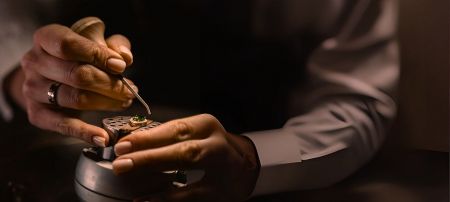 Expert craftsman assembling a high-quality custom jewelry piece, showcasing JR Fashion Accessories' manufacturing precision.