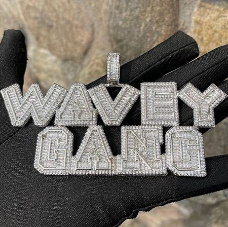 Custom hip hop pendant with 'WAVEY GANG' design in sparkling diamonds.