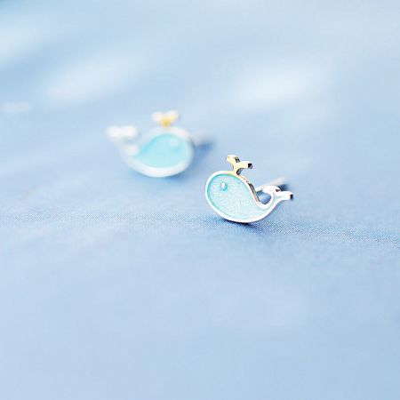 925 Sterling Silver Small Sea Cute Blue Whale Stud Earrings - A pair of 925 sterling silver whale-shaped stud earrings with a delicate light blue enamel finish, shown on a clean white background.