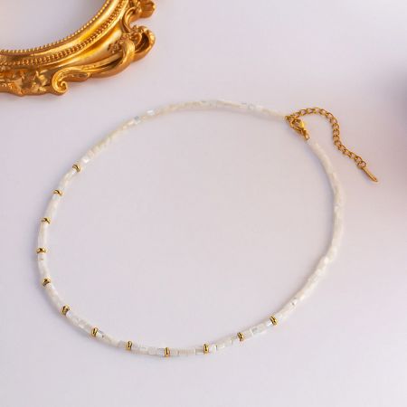 Lifestyle image showing the necklace worn with a casual outfit.