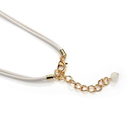 Detail of the necklace's gold chain and secure lobster clasp.