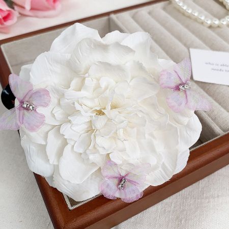 Elegant white peony flower claw hairclip showcased in a stylish jewelry box.