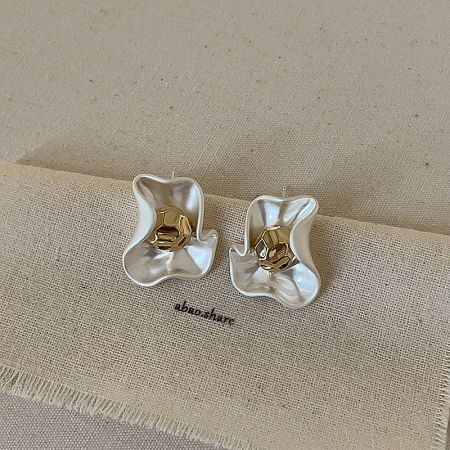 Side profile of the versatile vintage stud earrings, showing the craftsmanship and secure backing.