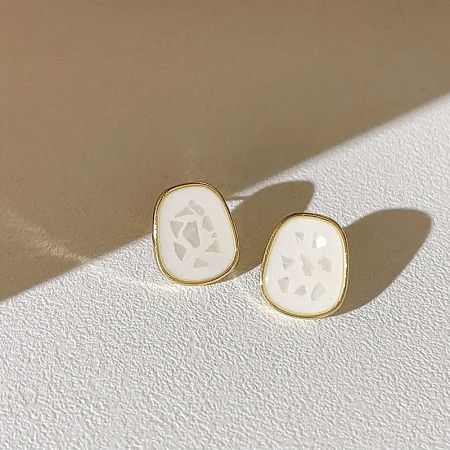 Detailed view of a unique cutout pattern design from the 5-pair earring set.