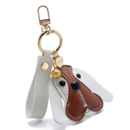 The stylish white PU leather dog keychain with a gold clasp, shown against a clean background.