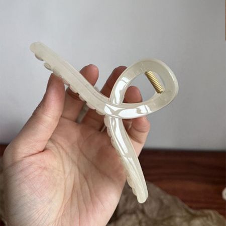 White acetate hair jaw clip with French design.