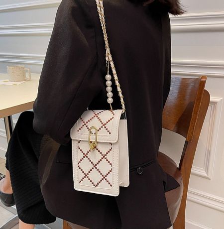 Elegant white and red design with a unique pearl strap option for a sophisticated look.