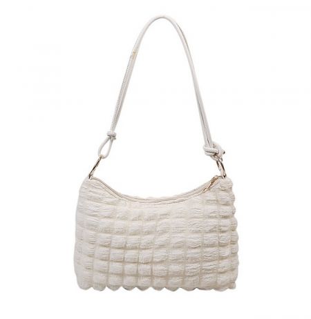 A chic white handbag with a unique quilted texture, demonstrating custom bag manufacturing capabilities.