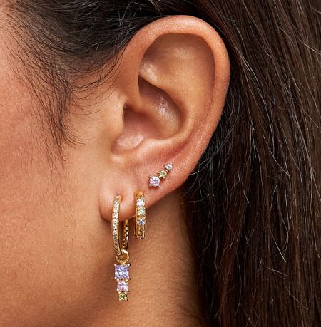 A close-up view of the baguette dangle drop earrings with colorful stones being worn, showcasing their elegant look.