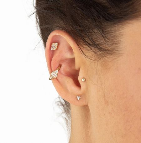 Model showcasing the versatile wear of the cartilage stud earring set.