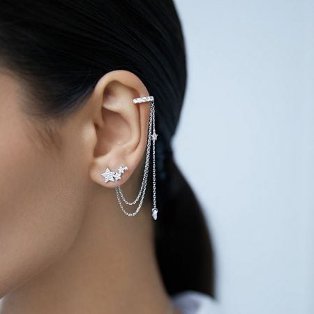 Model wearing the sterling silver CZ star tassel ear cuff to showcase its elegant fit.