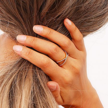 Lifestyle image of the 18K gold plated pearl cross ring.