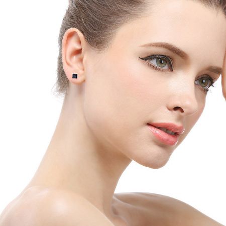 Model wearing the starry night stud earrings to showcase their size and style.