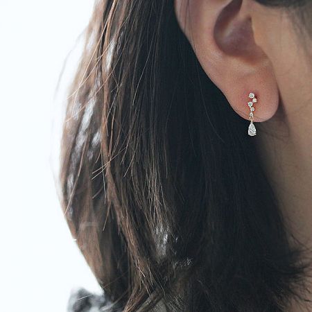 Model showcasing the sparkling crystal drop earrings, highlighting their elegant drape.