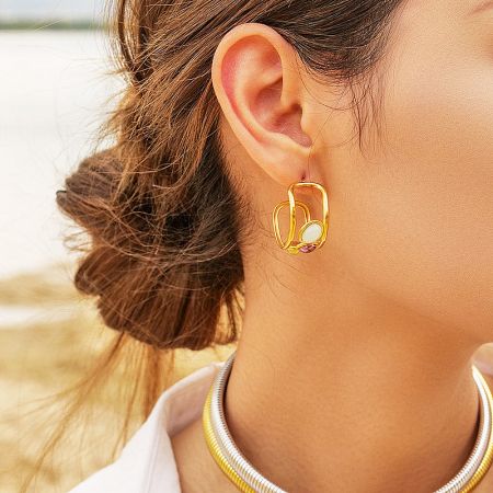 Stainless Steel Spanish-Style Three-Color Opal Stone Stud Earrings - A close-up of a woman wearing the stainless steel Spanish-style stud earrings with three-color opal stones, showcasing their elegant look.