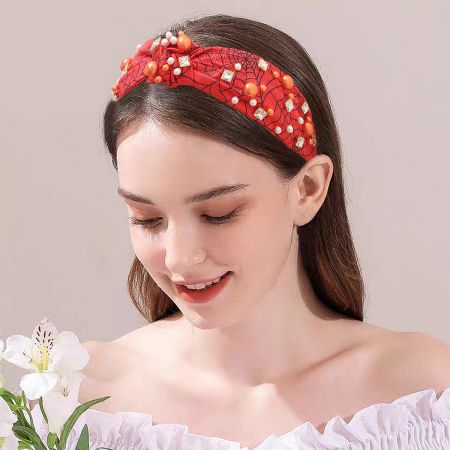 Model wearing a red beaded Halloween headband, showcasing its stylish fit.