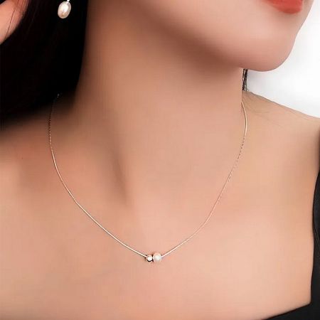 Model showcasing the 925 sterling silver pearl necklace, highlighting its elegant drape.