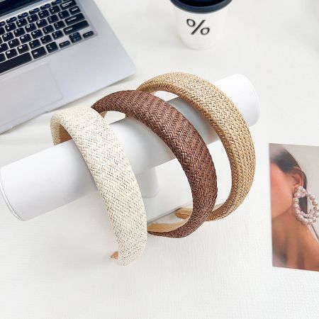 Three woven headbands displayed together, showing the different shades.