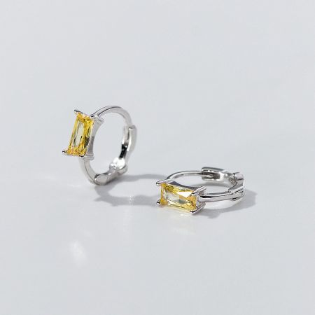 Detailed view of the yellow zircon sterling silver hoop earrings.