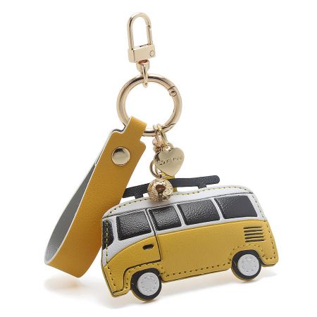 A cute yellow and white PU leather retro van keychain, perfect for adding a pop of color to bags or keys.