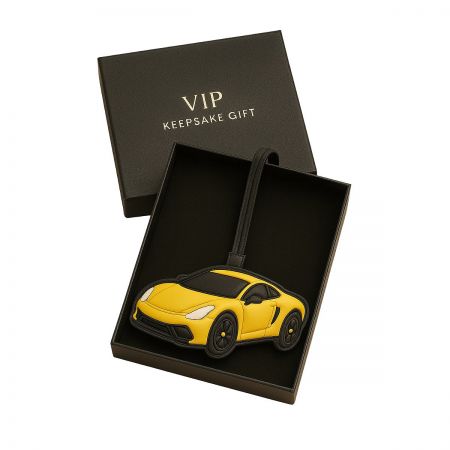 A yellow sports car leather keychain presented in a premium black gift box, ideal for corporate gifting.