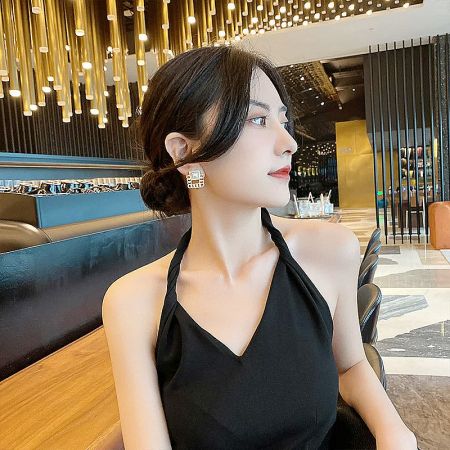 A model wearing the French style earrings, demonstrating their versatility and chic appeal in a lifestyle setting.