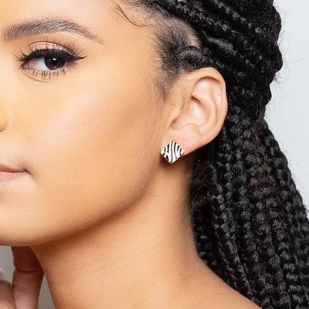 A stylish look featuring the gold-plated zebra print earrings.