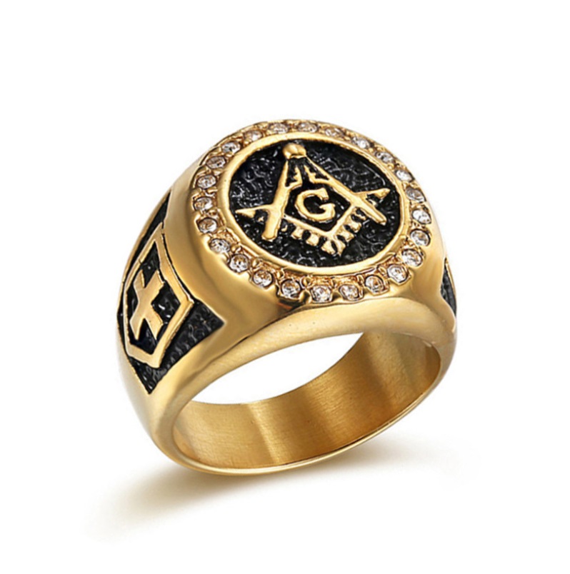 A detailed close-up of the Crystal Masonic Ring for men, crafted in gold and black stainless steel, prominently featuring the iconic square and compass symbol.