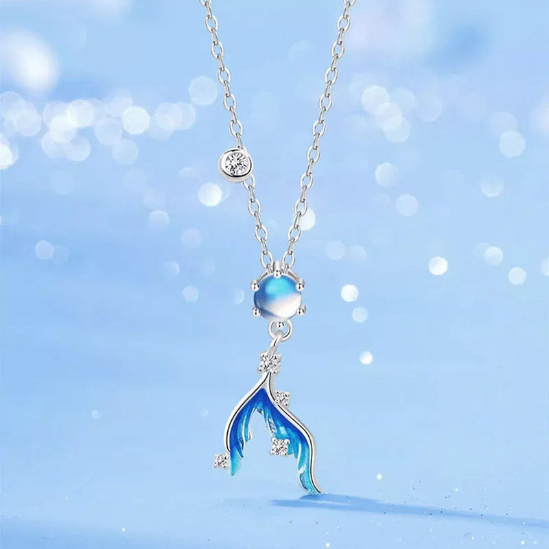 A stunning 925 sterling silver necklace featuring a mermaid tail pendant with a shimmering moonstone and clear gemstone accents.