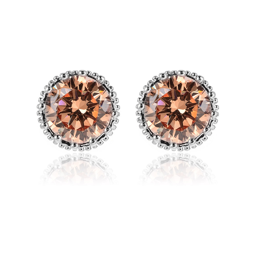A pair of Solitaire Stud Crown Earrings in rhodium plating, featuring peach-colored, faceted cubic zirconia gemstones in a detailed silver crown setting.