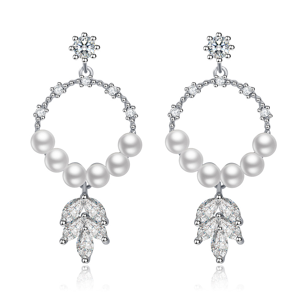 Chandelier Leaf Pearl Drop Earrings featuring a delicate leaf filigree pendant with sparkling cubic zirconia and a lustrous white pearl, rhodium plated.