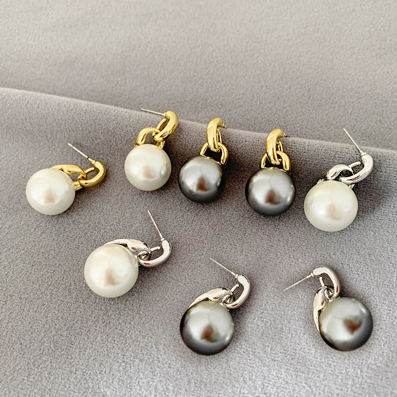 A collection of daily wear single pearl stud drop earrings with various gold and silver metal clasps, showcasing different styles.