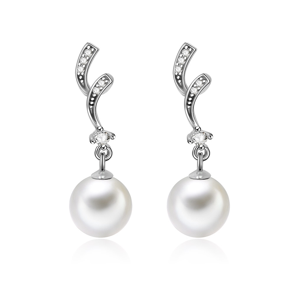 A pair of Silver Shell Pearl Earrings featuring large white pearls with oxidized 925 sterling silver hooks and sparkling cubic zirconia accents.