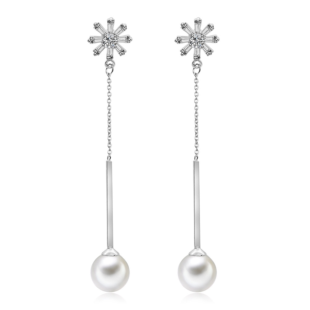A close-up view of the CZ Simulated Pearl Dangle Earrings, showcasing the intricate silver and crystal details above the lustrous pearl.