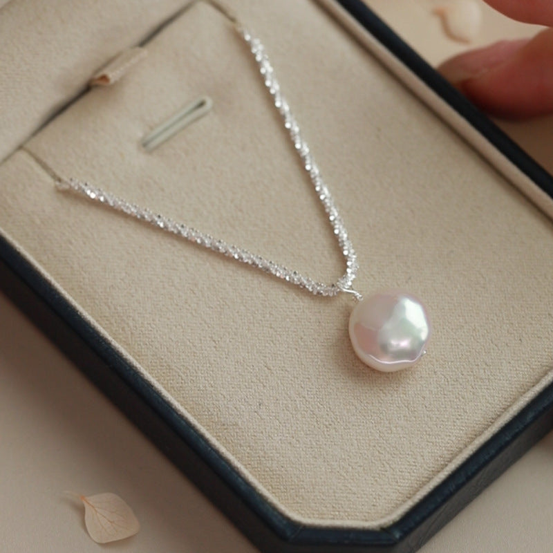 A stunning 925 sterling silver vintage baroque pearl necklace from a set of five, elegantly displayed in a jewelry box.