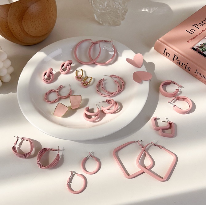 A collection of stylish pink enamel earrings in various shapes, displayed for wholesale by JR Fashion Accessories.