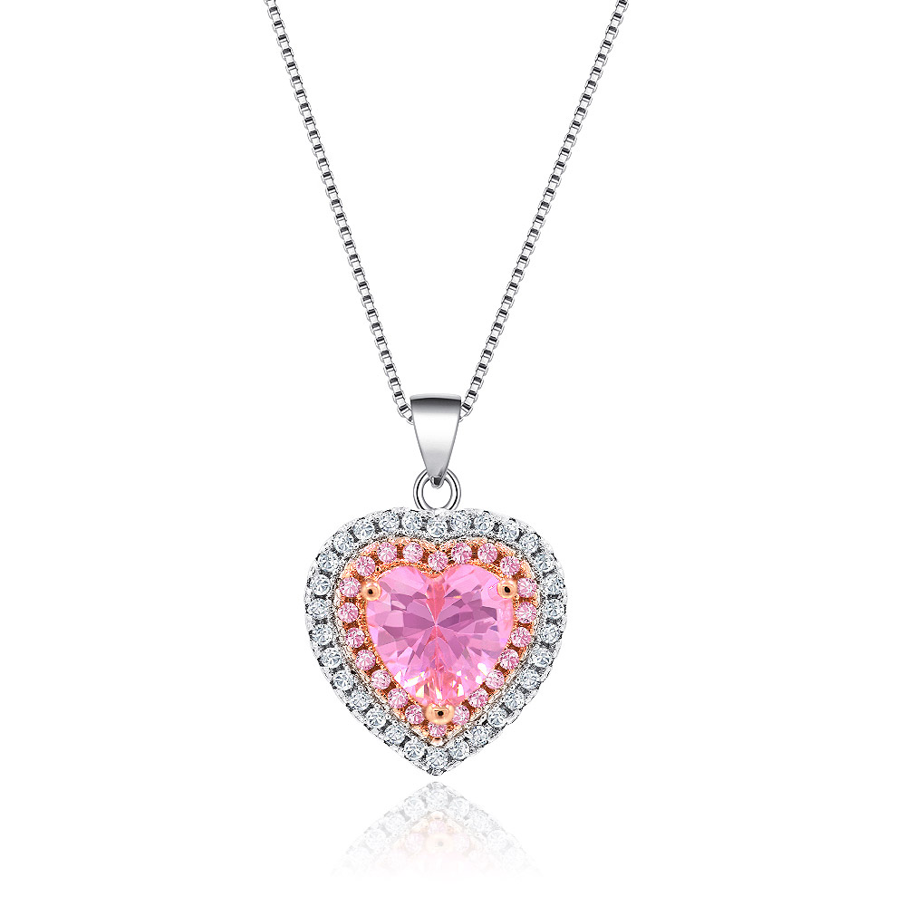 A detailed view of the Heart Shape Gemstone I Do Necklace, showcasing its pink heart-shaped cubic zirconia centerpiece and two-tone rhodium and rose gold plated setting.