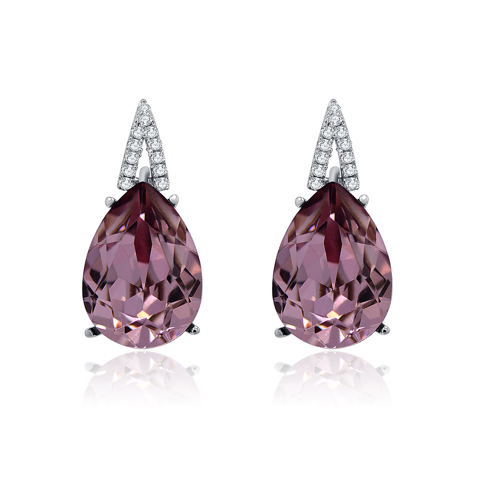 Close-up of S925 vintage pierced purple earrings featuring large pink teardrop Swarovski crystals with diamond-studded triangular tops, set in rhodium-plated sterling silver.