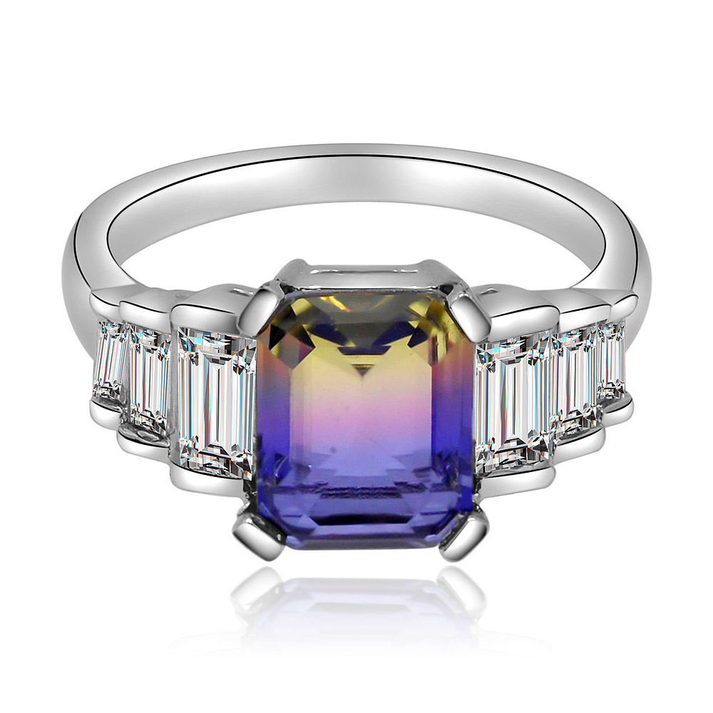 Front view of the Rainbow Cushion Princess Ring, featuring a large rectangular-cut gradient gemstone and a silver band adorned with clear cubic zirconia.